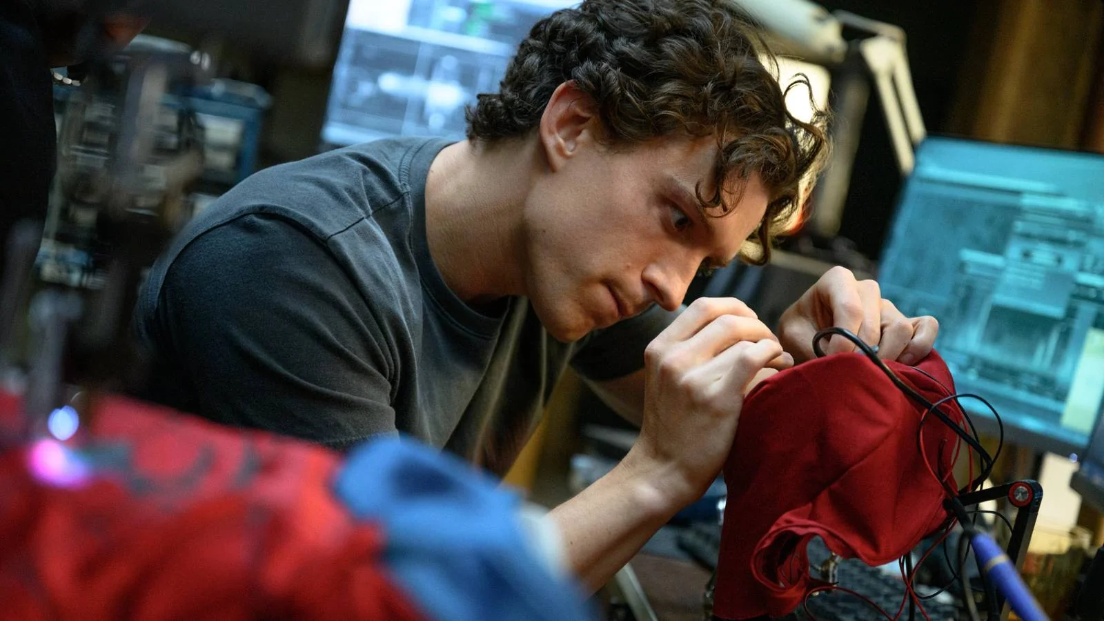 Peter Parker repairing his mask in Spider-Man: Brand New Day