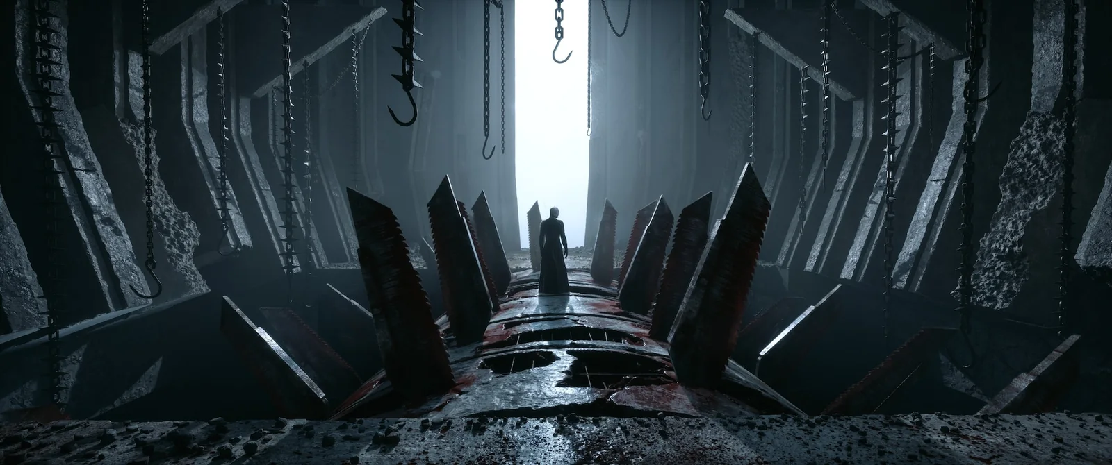 A lone robed figure walking a corridor lined with giant bloodied blades and hanging hooks, toward a wall of white light